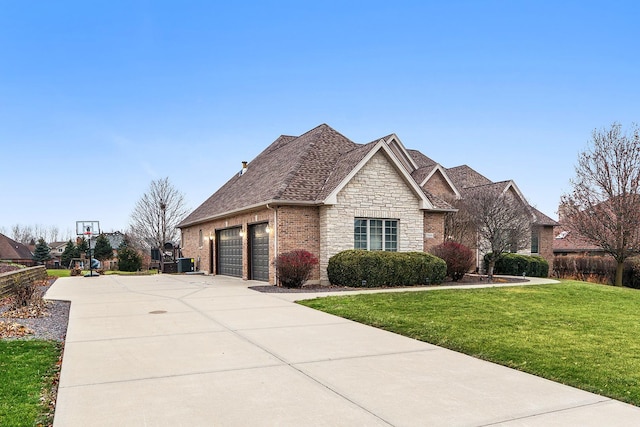 view of front facade with a garage and a front lawn