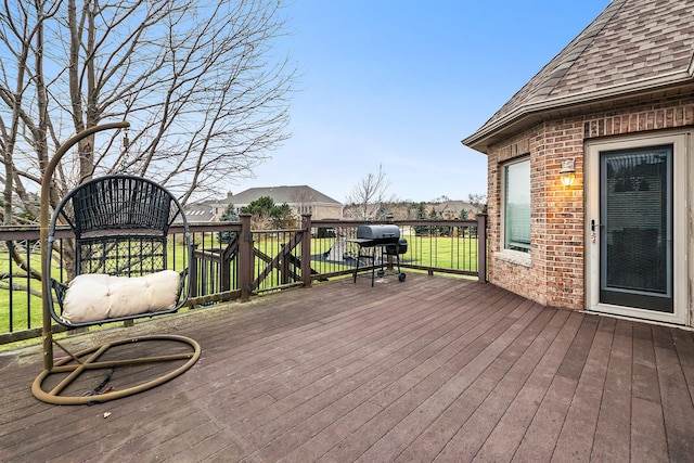 wooden deck with grilling area