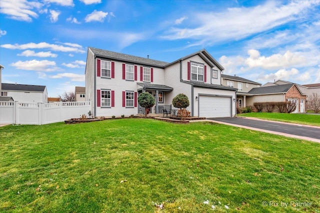 view of front of house featuring a front yard and a garage