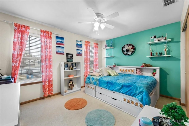 bedroom with ceiling fan and carpet floors