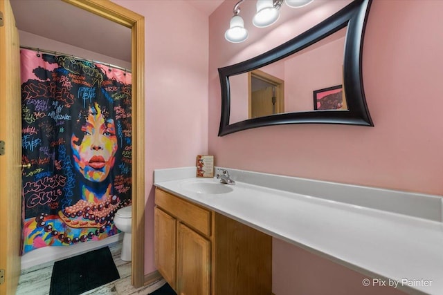 bathroom with vanity and toilet