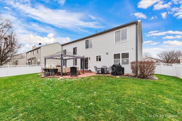 rear view of property featuring a pergola, a patio, and a lawn