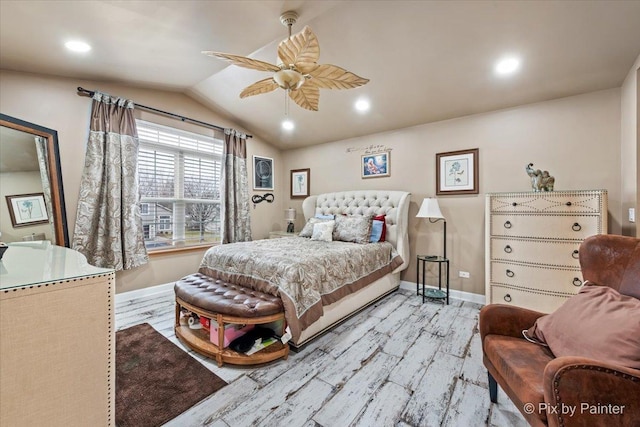 bedroom featuring ceiling fan, light hardwood / wood-style floors, and vaulted ceiling