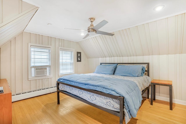 bedroom with cooling unit, baseboard heating, ceiling fan, light hardwood / wood-style floors, and lofted ceiling