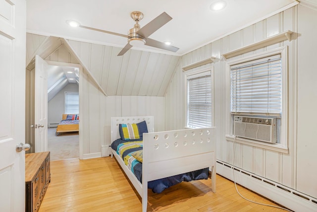 bedroom featuring multiple windows, ceiling fan, and vaulted ceiling