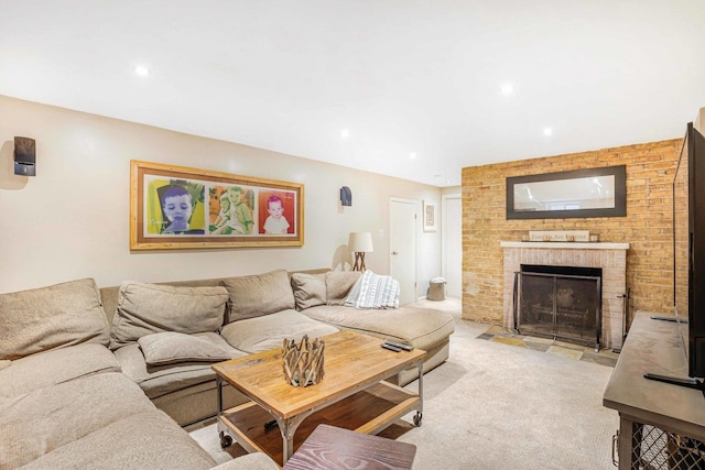 living room featuring light carpet and a brick fireplace