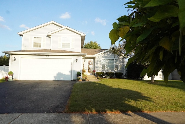 front of property with a front lawn and a garage