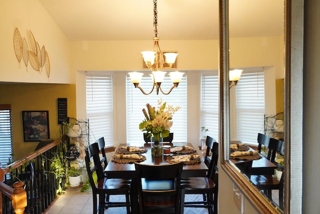 dining room with a chandelier, light tile patterned floors, and a healthy amount of sunlight