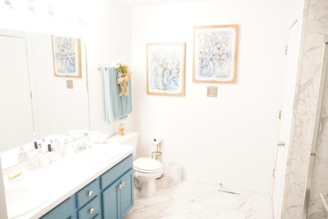 bathroom with vanity and toilet