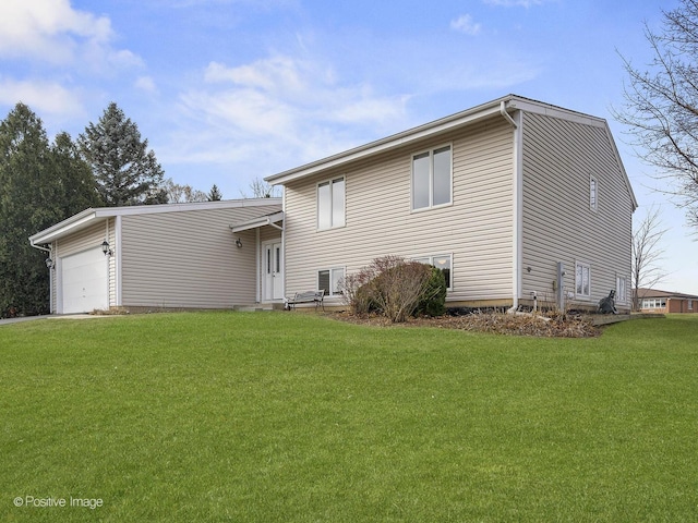 view of front of home with a garage and a front yard