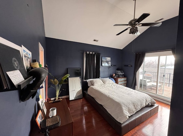 bedroom with ceiling fan, dark wood-type flooring, and high vaulted ceiling