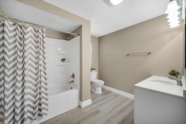 full bathroom featuring wood-type flooring, vanity, toilet, and shower / bath combo with shower curtain