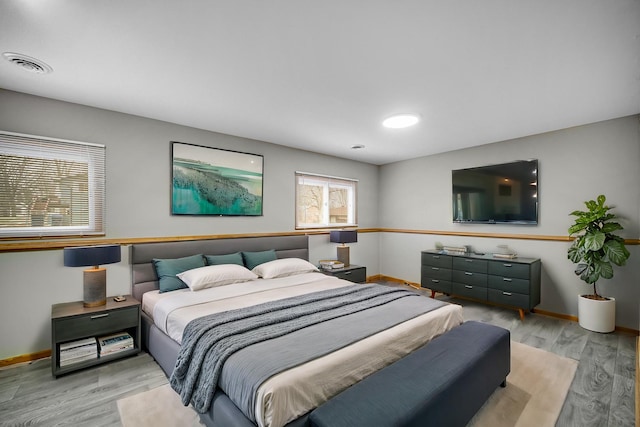 bedroom with light wood-type flooring