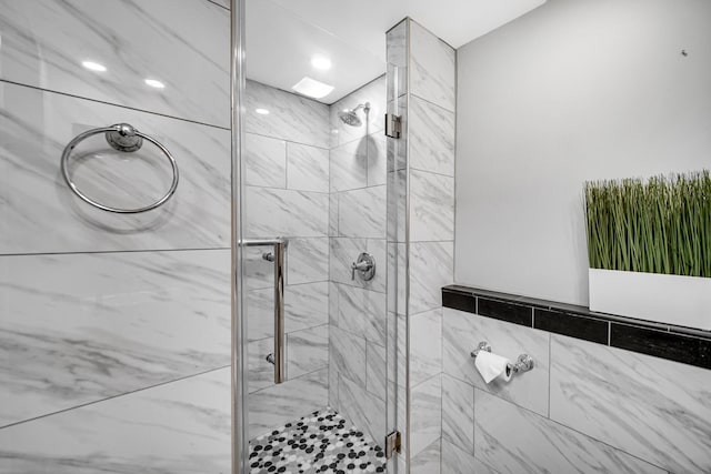 bathroom featuring an enclosed shower