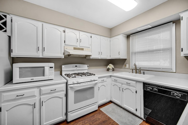 kitchen featuring sink, white cabinets, dark wood-type flooring, and white appliances