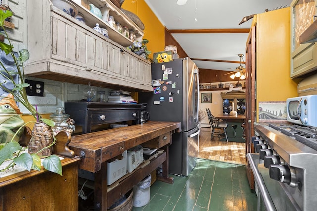 kitchen with stainless steel fridge, extractor fan, and ceiling fan