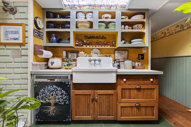 bar featuring washer / clothes dryer and sink