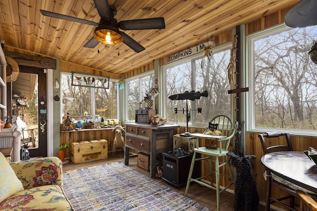 sunroom featuring ceiling fan, wood ceiling, and vaulted ceiling