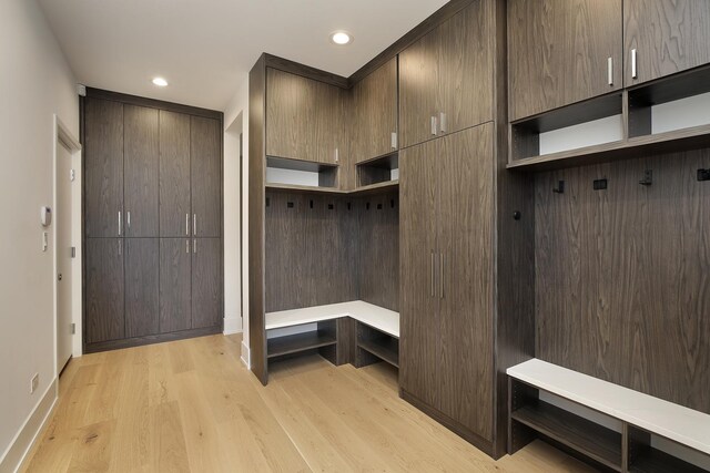 bathroom featuring vanity, tile walls, plus walk in shower, and lofted ceiling