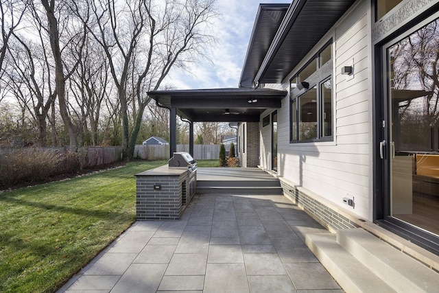 view of patio / terrace featuring fence