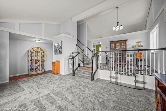 interior space featuring carpet, beam ceiling, high vaulted ceiling, and an inviting chandelier