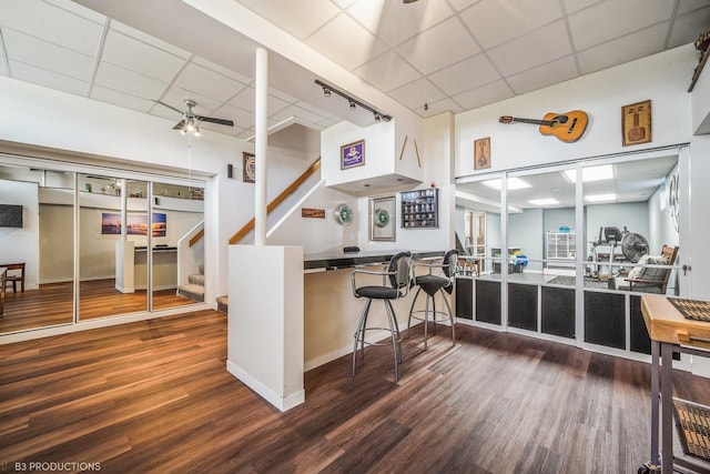 kitchen featuring a paneled ceiling, ceiling fan, and wood-type flooring