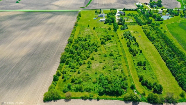 birds eye view of property with a rural view