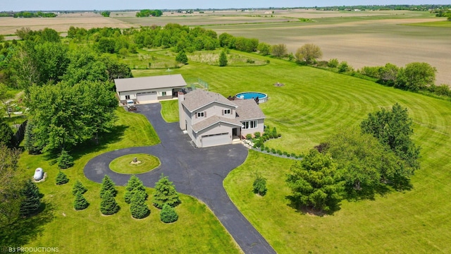 birds eye view of property featuring a rural view