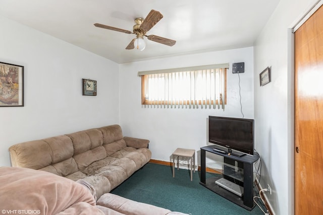 living room with ceiling fan and carpet