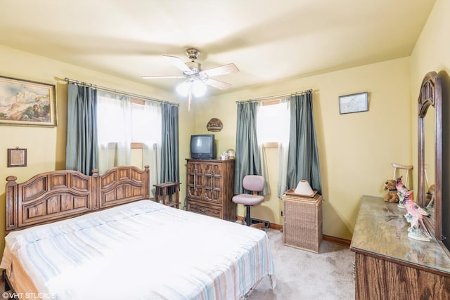 bedroom with light carpet and ceiling fan