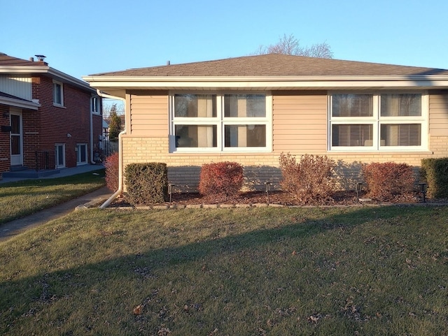 view of property exterior featuring a yard