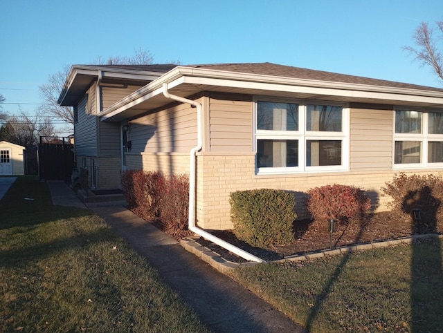 view of home's exterior featuring a lawn