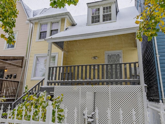 back of house with a porch