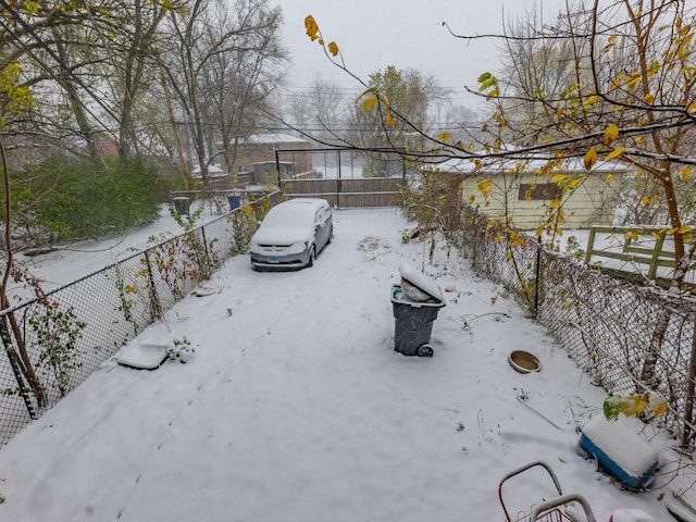 view of yard layered in snow