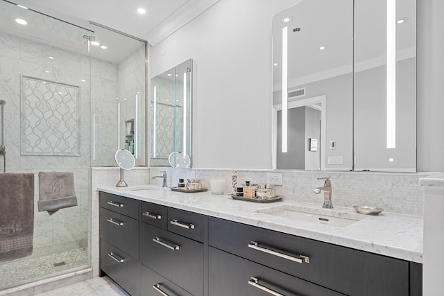 bathroom with backsplash, a shower with door, vanity, and ornamental molding