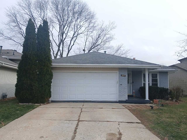 ranch-style home featuring a garage