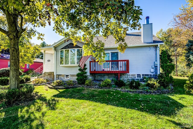 rear view of house with a yard