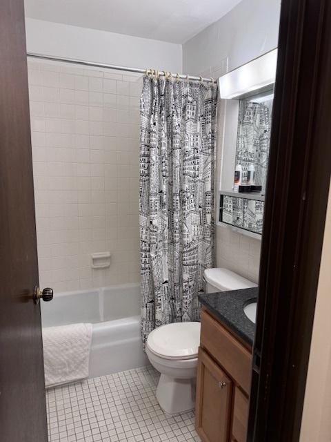 full bathroom with toilet, vanity, tile patterned flooring, and shower / bath combination with curtain