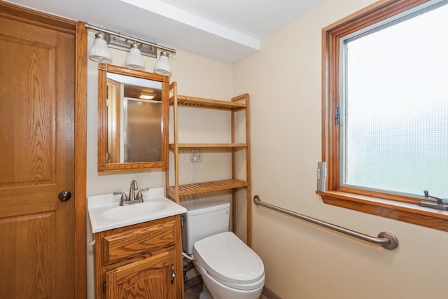 bathroom with toilet and vanity