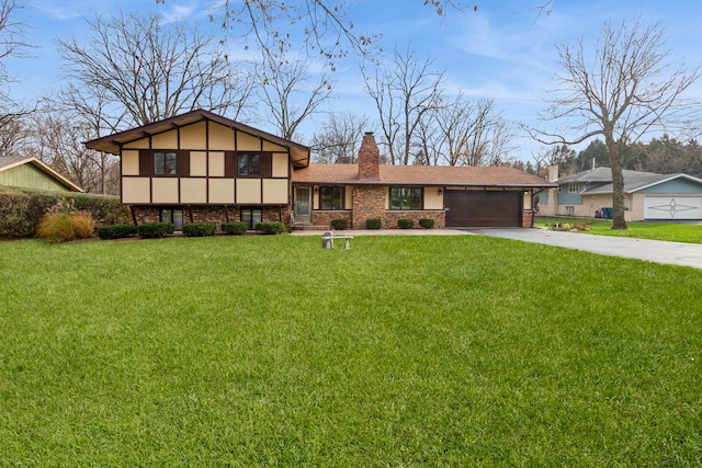 split level home with an attached garage, stucco siding, a chimney, a front lawn, and concrete driveway