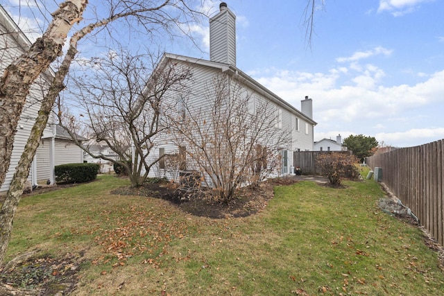 view of property exterior with a yard