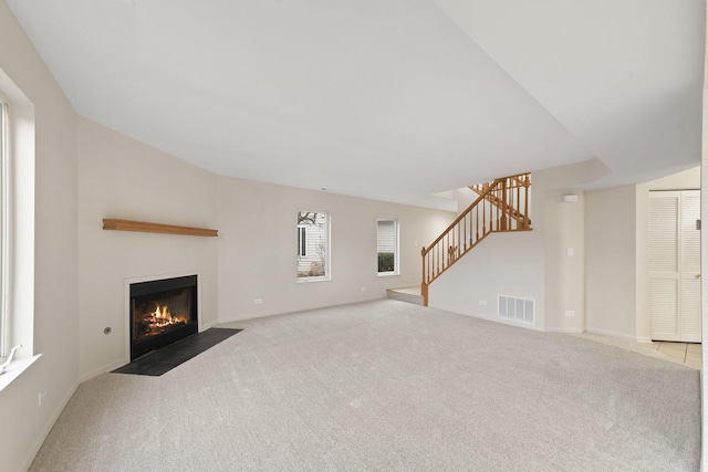 living room featuring light carpet