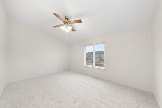 spare room featuring carpet and ceiling fan