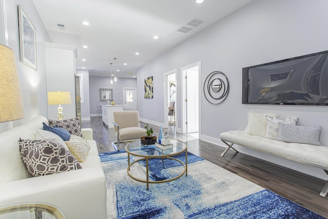 living room with dark wood-type flooring