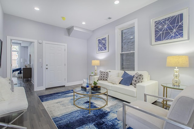 living room with dark hardwood / wood-style floors