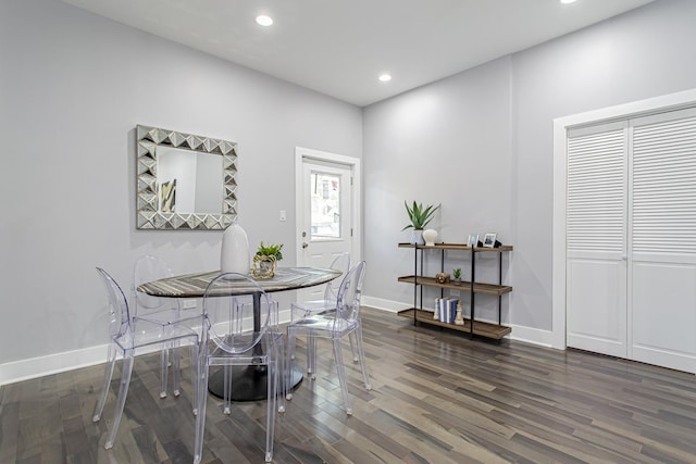 dining room with dark hardwood / wood-style floors