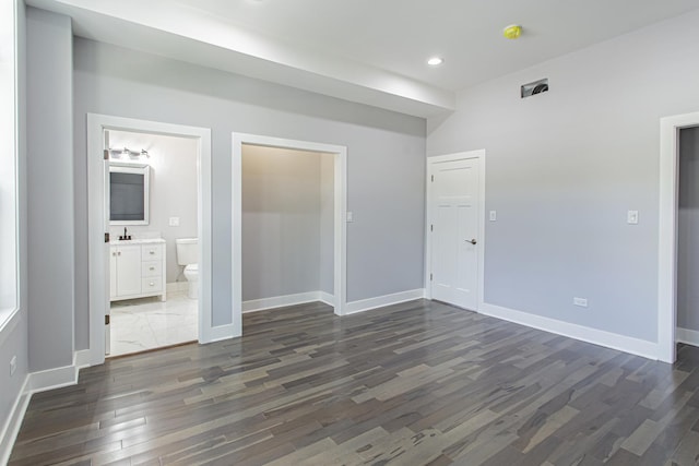 empty room featuring dark hardwood / wood-style flooring