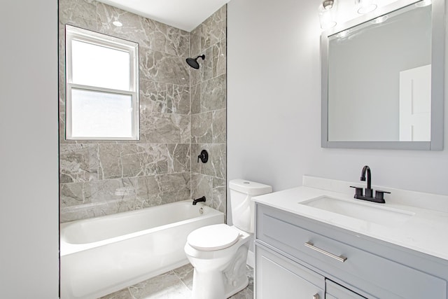 full bathroom with tile patterned floors, tiled shower / bath combo, toilet, and vanity