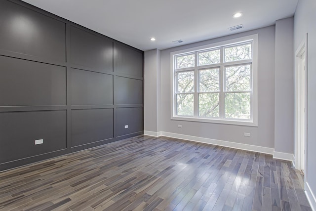 unfurnished room featuring dark hardwood / wood-style floors