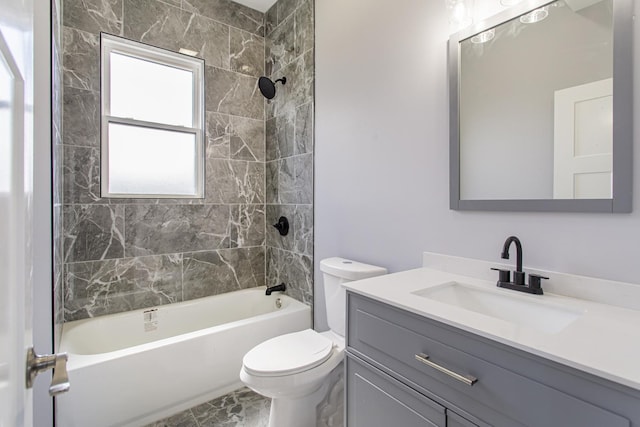 full bathroom with vanity, toilet, and tiled shower / bath